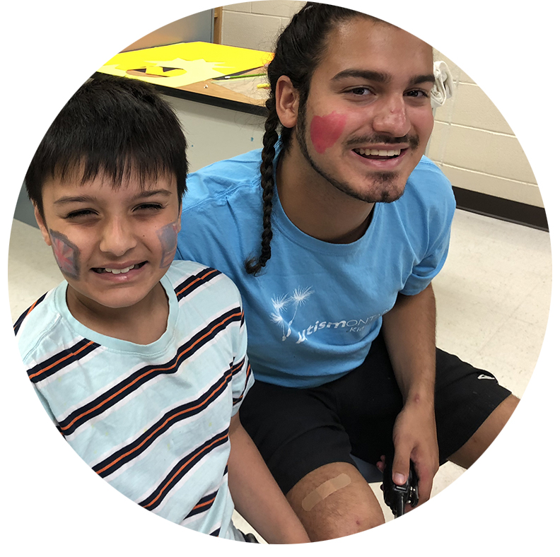 Young boy with autism with his support worker.